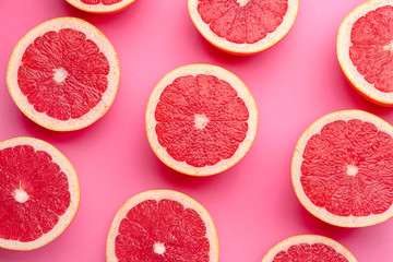 Fresh cut grapefruit on color background