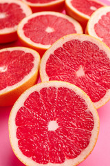 Fresh cut grapefruit on color background