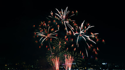 Beautiful fireworks against the background as over city scape view of night city in Thailand.