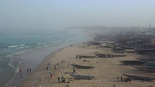 Aerial view of fishing village, pirogues fishing boats in Kayar, Senegal. Photo made by drone from above. Africa Landscapes.