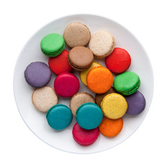 Fototapeta na wymiar colorful macaroons in a plate on a white background. Top view. Isolated