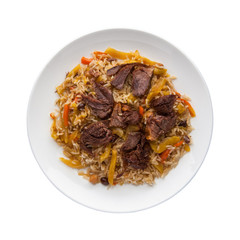 traditional pilaf with meat in a plate on a white background.  Top view. Isolated