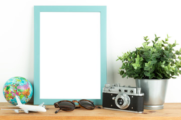 Interior poster mock up with vertical wooden frame, travel theme, on white wall background	