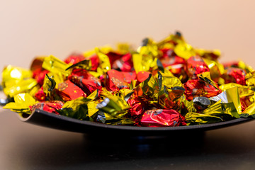 Christmas individually wrapped chocolate fondant in a bowl.