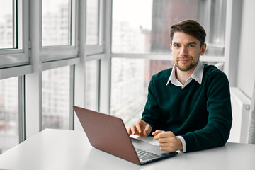 Fototapeta premium businessman working on his laptop in office