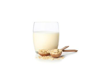 Oat milk and oatmeels in spoon isolated on white background