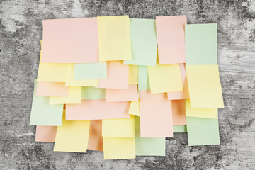 Fototapeta premium A lot of note papers on old wall