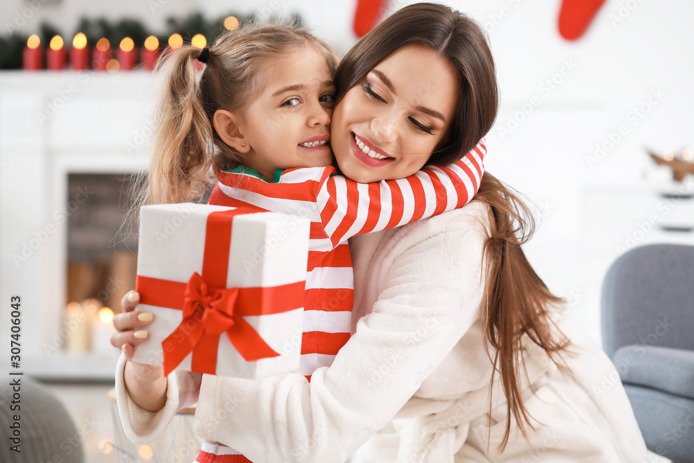 Sticker Woman and her little daughter with Christmas gift at home