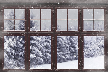 Window frame with snowy fir trees outside
