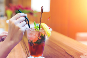 lemon, ice, tube and mint in mocktail on the table.