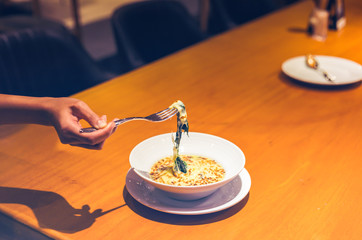 People use fork for pick Spinach cheese in the dish.