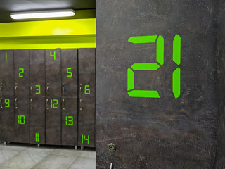 Closeup of locker number 21 in a locker or dressing room for changing clothes into sport outfit for gym or other sport clubs