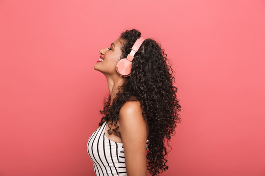 Image Of Happy African American Woman Listening To Music With Headphones