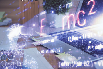 Desktop computer background and formula hologram writing. Double exposure. Education concept.