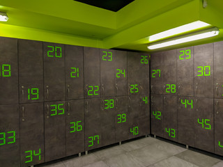 Cool and modern style in green and grey colors locker room or changing room for changing clothes and leaving stuff while doing a workout