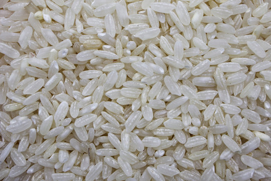 Uncooked white ribe rice background
