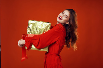 woman in red dress with gift