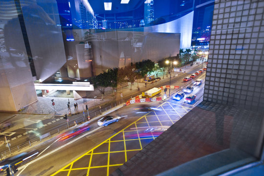 Cars Passing The Salisbury Road By Night In Kowloon, Hong Kong