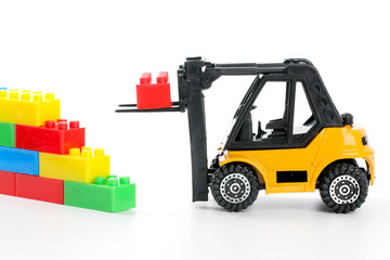 Plastic toy block over white background