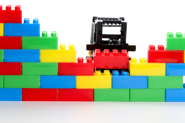Plastic toy block over white background