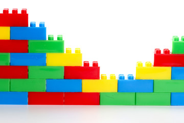 Plastic toy block over white background