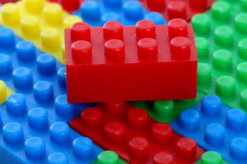 Plastic toy block over white background