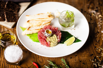 Tuna tartare served on a plate in restaurant