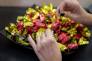 Christmas individually wrapped chocolate fondant in a bowl.