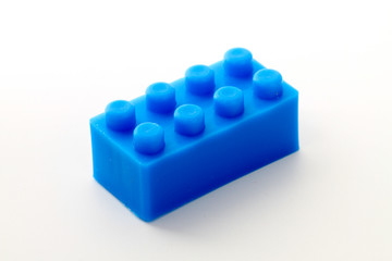Plastic toy block over white background