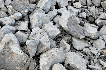 Hardcore waste recycling. Broken concrete slabs at construction site. oncrete rubble from demolition at landfill.  Recycling and reuse crushed concrete rubble, asphalt, building material, blocks.