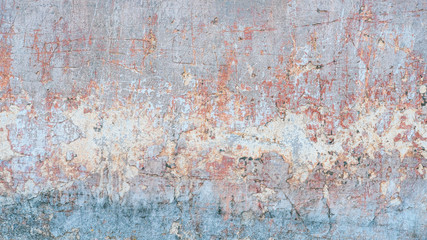 Creative abstract texture background. Beautiful turquoise, orange and grey grunge rough artistic old stone wall with cracks and scratches. Copy space