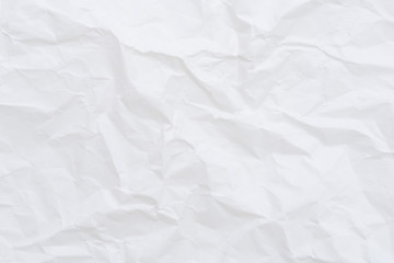 Modern crumpled white paper on empty sheet gray background with light shadows for creative...