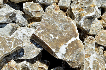 Natural gray gypsum stone. Close up image of stones with black and white. Industrial mining area. Limestone mining, quarry - Image