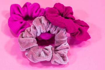 Three Pink Scrunchies on a Pink Background 