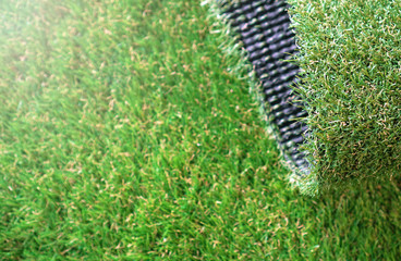 Artificial grass background. Landscape greenering with artificial turf.