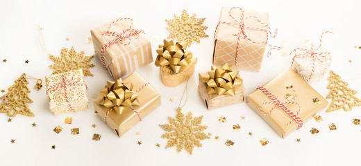 Gift or present boxes and stars confetti on white table top view. Flat lay composition for birthday, christmas or wedding.