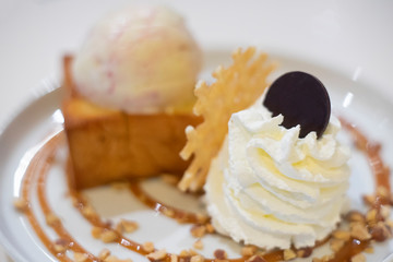 Whipping cream and Honey toast with strawberry chocolate chip icecream topping