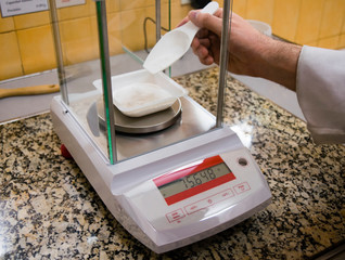 precision scale weighing powder substance