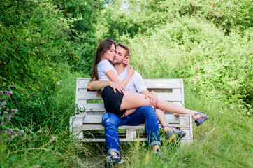 Love is in the air. man with woman in park. family weekend. romantic date. happy valentines day. summer camping in forest. sexy couple relax outdoor on bench. Secret place. couple in love. Happiness