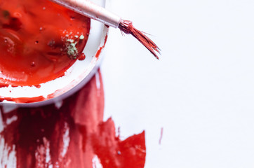 Stroke the Red Paint on the white canvas. Art process.