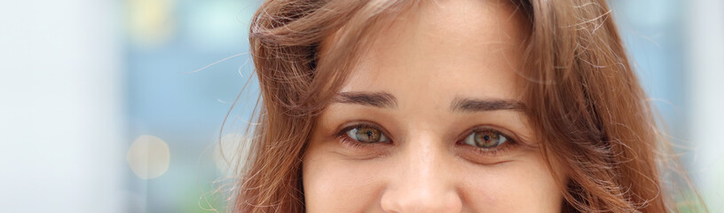 Close-up portrait of a woman, brown eyes.