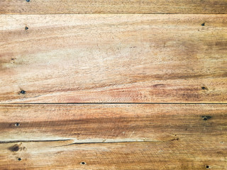 Fototapeta premium Top horizontal of light brown wood panel texture. Home furniture and natural design decoration. Wooden table top close up shot with copy space for text.