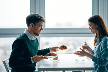 man and woman working in office