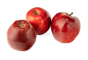 Red apples with apple slice and leaf isolated on a white background.