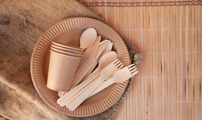 Eco paper utensils with cardboard, paper, wood. On an old wooden table, concept of zero plastic.