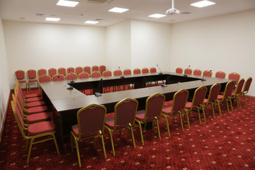 Prepared conference room for guests, with red carpet, clean, cozy, bright