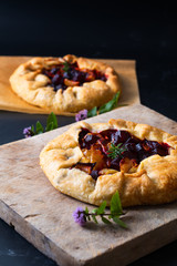 Healthy food concept preparation for Homemade rustic organic roasted beets and onion caramel galette pie with copy space