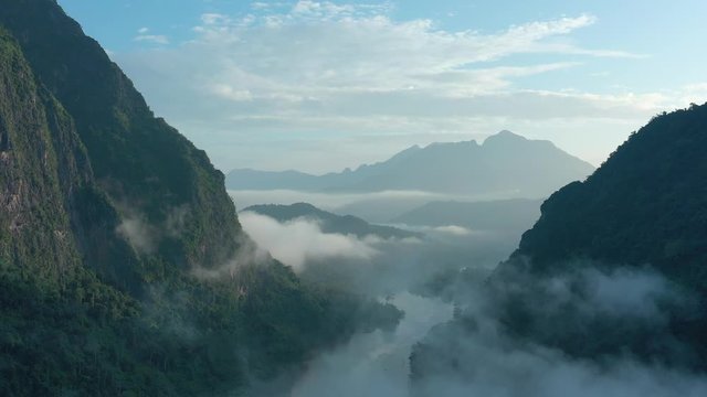 Aerial view of mountains and river Nong Khiaw. North Laos. Southeast Asia. Photo made by drone from above. Bird eye view.