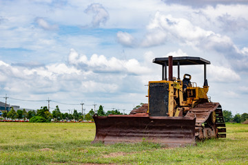 Fototapeta na wymiar Old rusty tractor in field