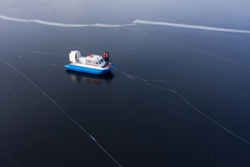 Coast guard. The hovercraft on the ice. The view from the top. - obrazy, fototapety, plakaty